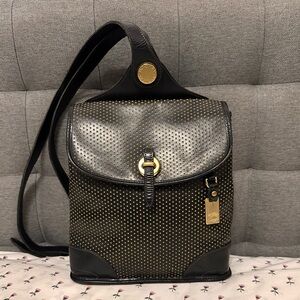 Vintage Y2K Dooney & Bourke Cabriolet black perforated leather backpack